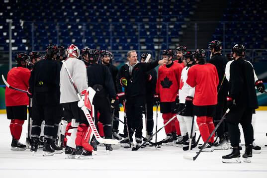 Head coach Jon Cooper of Canada at an ice hockey practice