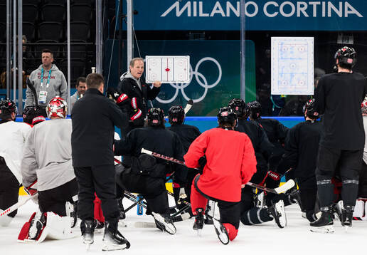 Head coach Jon Cooper of Canada at an ice hockey practice