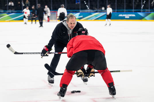 Head coach Jon Cooper of Canada at an ice hockey practice
