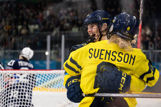 Thea Johansson and Hilda Svensson of Sweden celebrate the