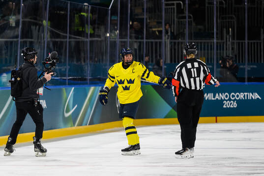 Anna Kjellbin of Sweden reacts in the women's ice hockey