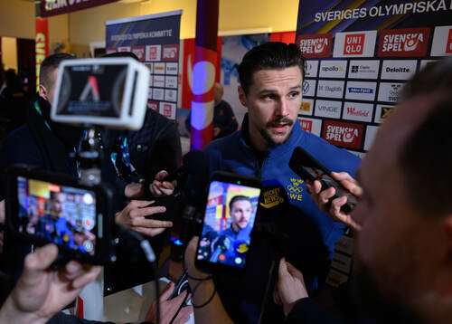 Erik Karlsson is interviewed at a press conference with the