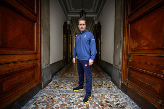 Head coach Sam Hallam poses for a portrait at a press