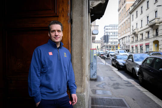 Head coach Sam Hallam poses for a portrait at a press