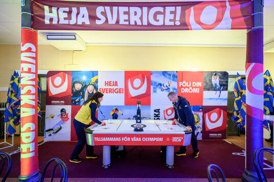 Sara Gottfarb and Christofer Waller playing air hockey at