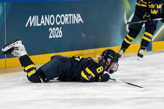Hilda Svensson of Sweden in pain in the women's ice hockey