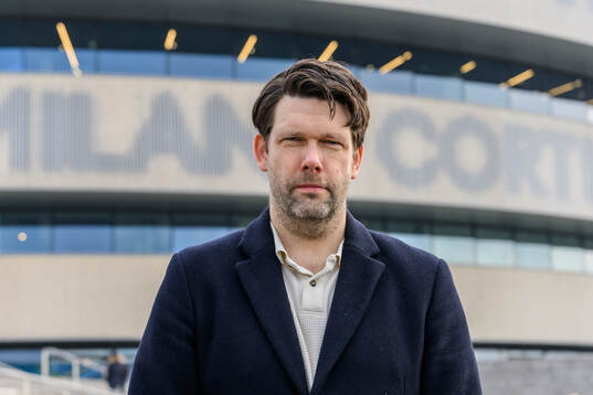 Swedish journalist Carl Juborg poses for a portrait outside