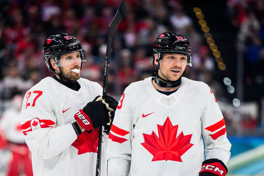 Shea Theodore and Sam Reinhart of Canada in the men's ice
