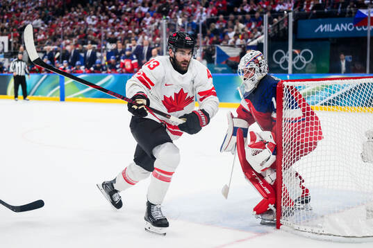 Tom Wilson of Canada and goaltender Lukas Dostal of Czech