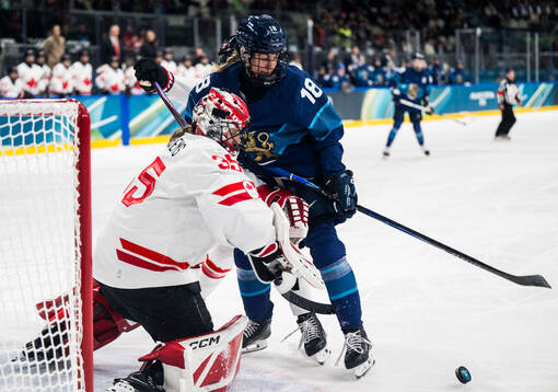 goaltender Ann-Renee Desbiens of Canada and Jenniina Nylund
