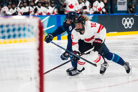 Nelli Laitinen of Finland and Sarah Fillier of Canada in