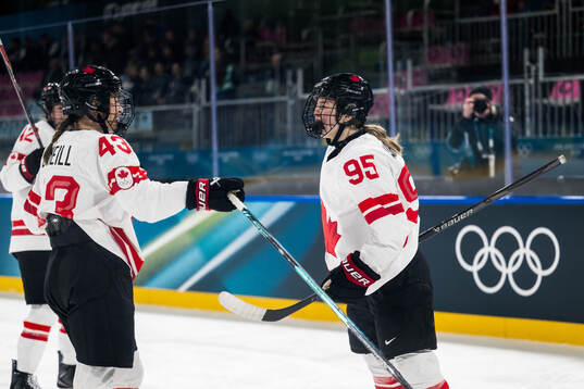 Kristin O'Neill and Daryl Watts of Canada celebrates
