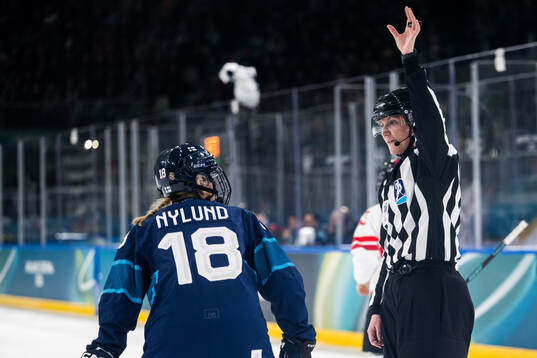 Jenniina Nylund of Finland and Linesperson Jessica Lundgren