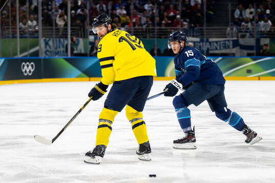 Adrian Kempe of Sweden and Anton Lundell of Finland in the