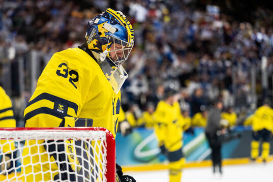 Goaltender Filip Gustavsson of Sweden looks dejected