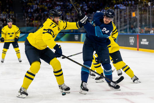 Victor Hedman of Sweden and Roope Hintz of Finland in the