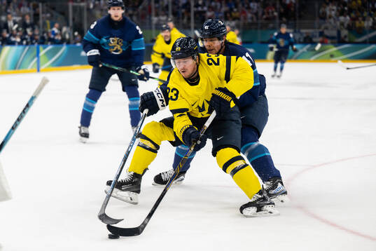 Lucas Raymond of Sweden and Miro Heiskanen of Finland in