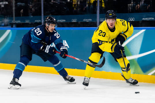 Sebastian Aho of Finland and Lucas Raymond of Sweden in the