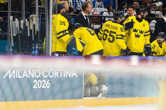 Philip Broberg of Sweden is in pain in the men's ice hockey