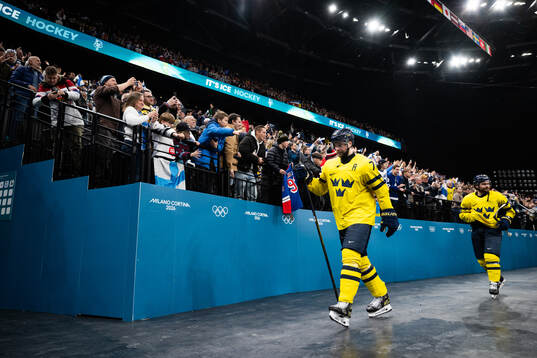 Victor Hedman and Rasmus Andersson of Sweden look dejected