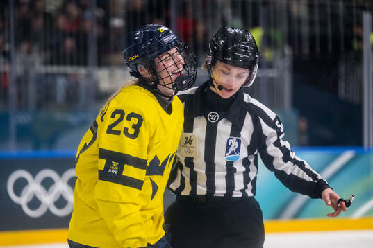 Thea Johansson of Sweden reacts in the women's ice hockey