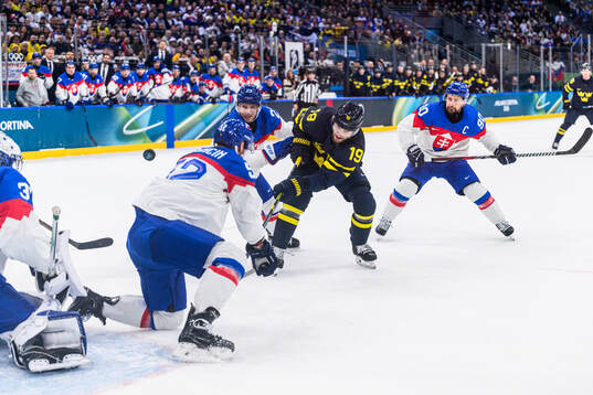 Adam Liska and Tomas Tatar of Slovakia and Adrian Kempe of