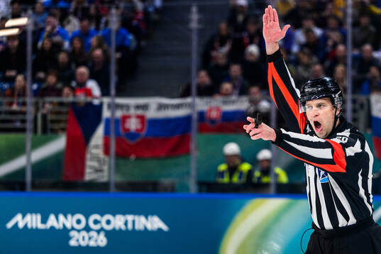 Referee Andris Ansons in the men's ice hockey game between