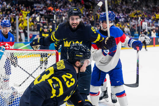 Mika Zibanejad and Lucas Raymond of Sweden celebrate 5-2 in