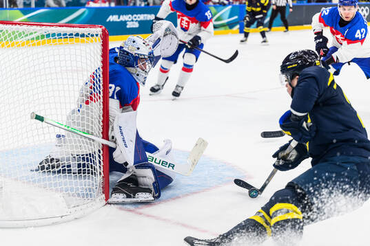 Goaltender Samuel Hlavaj of Slovakia and Lucas Raymond of