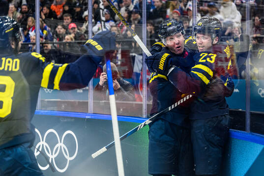 Rasmus Dahlin and Lucas Raymond of Sweden celebrate 5-2 in