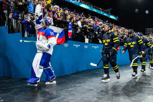 Goaltender Samuel Hlavaj of Slovakia celebrates and Gabriel
