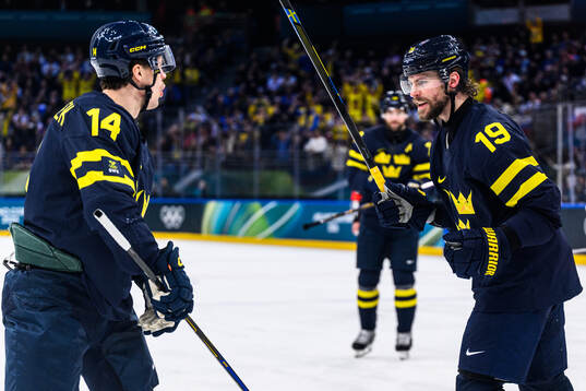 Joel Eriksson Ek and Adrian Kempe of Sweden celebrate 1-0