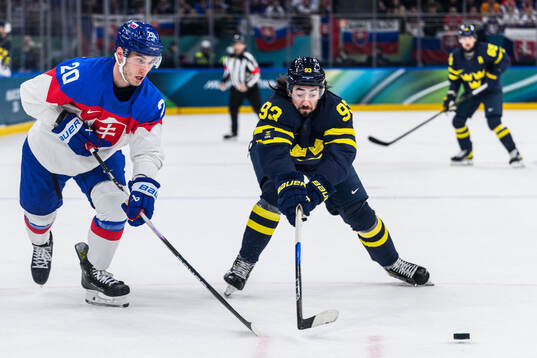 Juraj Slafkovsky of Slovakia and Mika Zibanejad of Sweden