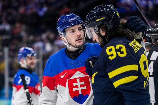 Oliver Okuliar of Slovakia and Mika Zibanejad of Sweden in