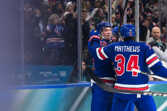 Matt Boldy and Auston Matthews celebrate