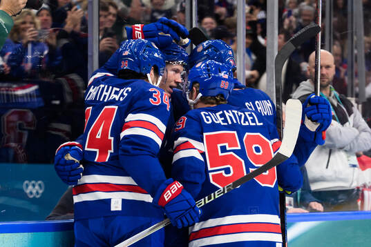 Matt Boldy celebrate with Auston Matthews and Jake Guentzel