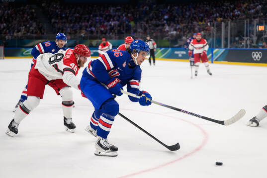 Nicholas B Jensen of Denmark and Jack Hughes of USA in the