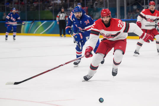 Auston Matthews of USA and Markus Lauridsen of Denmark in