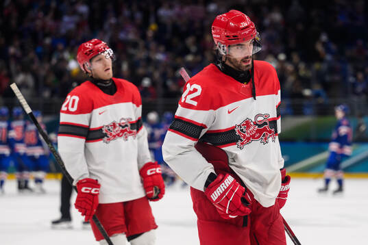 Lars Eller and Markus Lauridsen of Denmark look dejected
