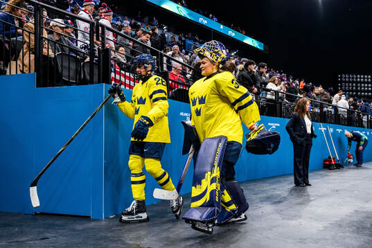 Hanna Olsson and goaltender Emma Söderberg of Sweden looks