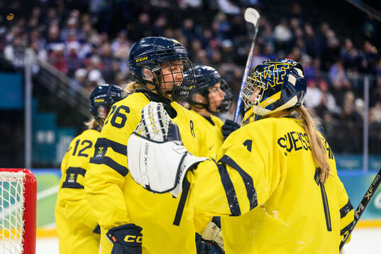 Hanna Olsson and goaltender Ebba Svensson Träff of Sweden