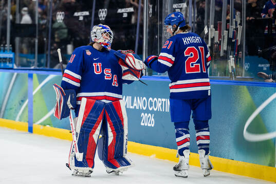 goaltender Aerin Frankel and Hilary Knight of USA celebrate