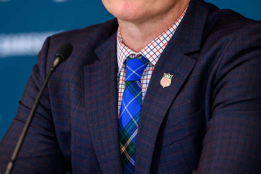 A detailed view of the tie of head coach John Wroblewski of