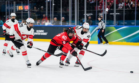 Blayre Turnbull of Canada against Alina Muller and Nicole