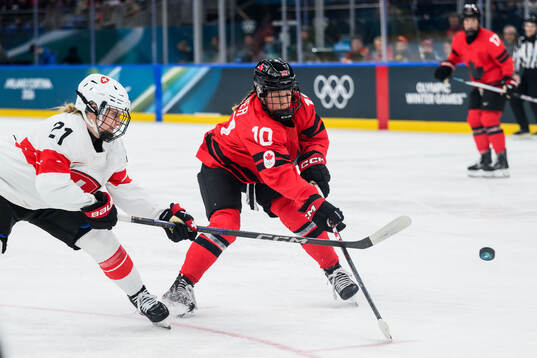 Rahel Enzler of Switzerland and Sarah Fillier of Canada in