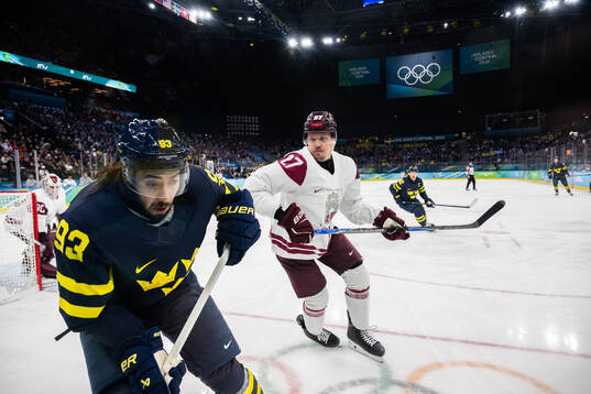 Mika Zibanejad of Sweden and Oskars Cibulskis of Latvia in
