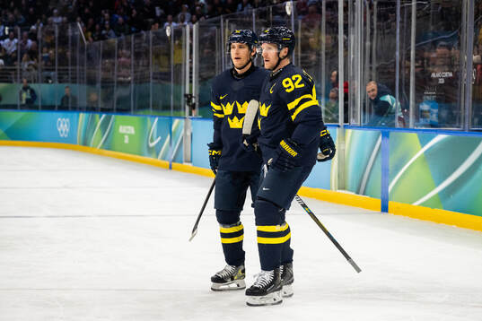 Gustav Forsling and Gabriel Landeskog of Sweden celebrate