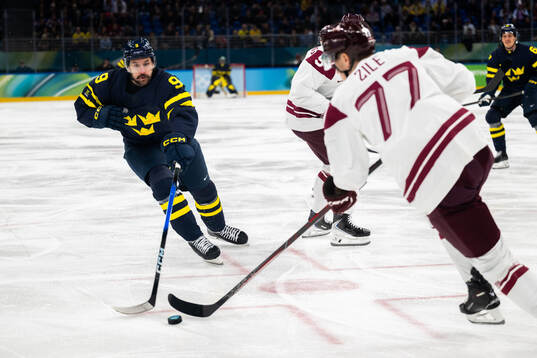 Filip Forsberg of Sweden and Kristaps Roberts Zile of