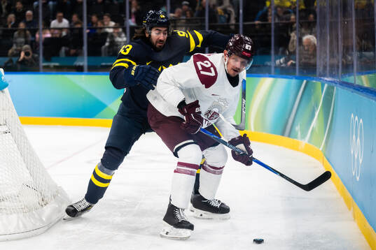 Mika Zibanejad of Sweden and Oskars Cibulskis of Latvia in