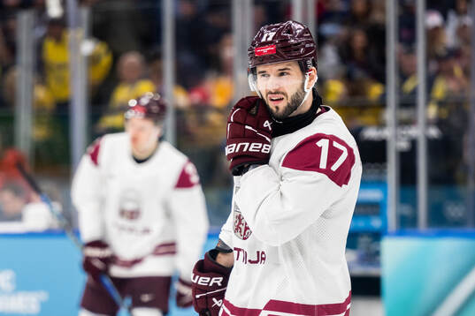Martins Dzierkals of Latvia looks dejected in the men's ice